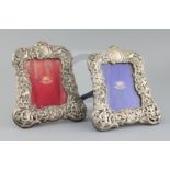 A pair of Edwardian repousse silver mounted photograph frames, by Goldsmiths & Silversmiths Co