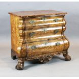 A 19th century Dutch walnut and marquetry bombe commode, with serpentine top and three drawers, on