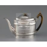 A George III silver oval teapot, by John Eames, with engraved bands and two engraved wreaths,