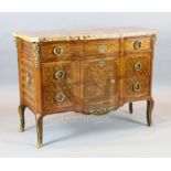 An early 20th century French Transitional style marquetry breakfront commode, with mottled