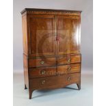 A George III Hepplewhite period mahogany dwarf linen press with moulded cornice and two panelled