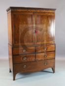 A George III Hepplewhite period mahogany dwarf linen press with moulded cornice and two panelled