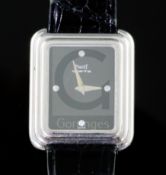 A lady's modern 18k white gold Piaget quartz rectangular wrist watch with diamond chip set dial,