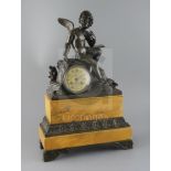 A 19th century French bronze and simulated Sienna marble mantel clock, surmounted with Cupid