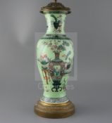 A Chinese famille verte lime green ground vase, late 19th century, painted with Hundred Antiques,