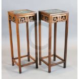 A pair of Chinese hardwood vase stands, each inset with cloisonne panels depicting birds on a branch