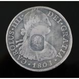 A rare George III octagonal countermarked silver dollar, crisp countermark on a fairly worn 8 Reales