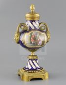 A late 19th century French ormolu mounted Sevres style porcelain cassolette, painted with panels