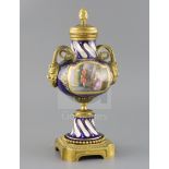 A late 19th century French ormolu mounted Sevres style porcelain cassolette, painted with panels