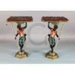 A pair of late 19th century Florentine carved and painted wood blackamoor occasional tables, with