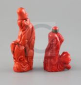 Two Chinese carved coral snuff bottles one with fish beside water plants, the other as a sage,