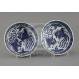A pair of Chinese Ming blue and white 'phoenix' saucer dishes, pseudo Wanli mark, 17th century,