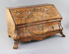 A late 18th century Dutch walnut and marquetry table top bureau, the fall enclosing a pigeon hole