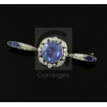 An early 20th century French platinum, sapphire and diamond bar brooch, the central round cut