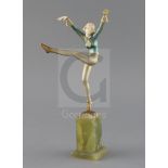 An Art Deco cold painted bronze and ivory figure, by Dakon, signed to the base, on a green onyx