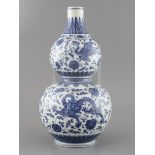 A Chinese blue and white 'dragon and phoenix' double gourd vase , Qianlong mark but late 19th/