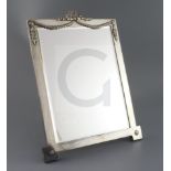 An Edwardian silver rectanglar easel mirror, London, 1904, with swag and ribbon surmount, with