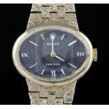A lady's 1970's 9ct gold Rolex Precision manual wind wrist watch, with black oval dial, on