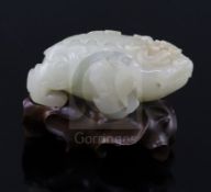 A Chinese pale celadon jade figure of lion-dog, bixi, 17th century, the stone of even tone with