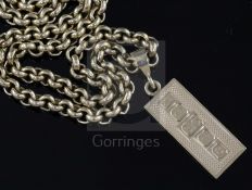 A heavy 9ct gold circular link chain with 1970's 9ct gold ingot pendant, chain 59cm, ingot 38mm,