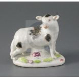 A rare Longton Hall figure of a ewe, c.1752, standing on an oval base painted and applied with