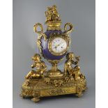 Vernet, Rue du Bac 42. A 19th century French ormolu and bleu du roi porcelain mantel clock, of urn