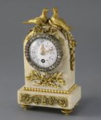 An early 20th century French ormolu mounted white marble desk timepiece, surmounted with two