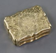 A mid 19th century unmarked gold (tests as 15ct) vinaigrette, in fitted box, with engraved scroll