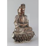 A large Chinese lacquered bronze seated figure of Guanyin, on a separate lotus stand, her robes