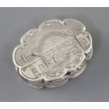 A Victorian silver cusped oval vinaigrette by Nathaniel Mills, the lid engraved with houses,