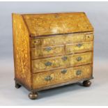 A 19th century Dutch walnut and marquetry bureau, decorated throughout with floral motifs and