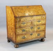 A 19th century Dutch walnut and marquetry bureau, decorated throughout with floral motifs and