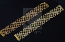 A near pair of early 1970's import marked textured 18ct gold 'knot link' bracelets, one with