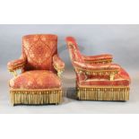 A set of four Victorian giltwood armchairs, ornately upholstered in tasselled gold and red foliate