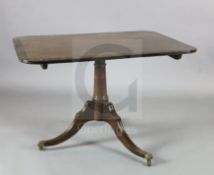 A Regency coromandel wood banded mahogany breakfast table, with rectangular tilt top, canon barrel