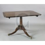 A Regency coromandel wood banded mahogany breakfast table, with rectangular tilt top, canon barrel