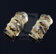 A pair of modern 18ct gold Cartier earclips, of pierced oval design, signed and numbered 774946,