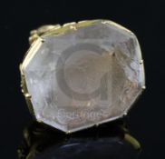 A Victorian pierced gold mounted rock crystal? set fob seal, the matrix carved with ornate crest,