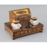 A 19th century Tunbridge ware rosewood and floral mosaic desk stand, the pair of glass inkwells with