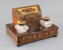 A 19th century Tunbridge ware rosewood and floral mosaic desk stand, the pair of glass inkwells with