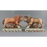 A near pair of large Ralph Wood type pearlware figures of 'Medici' lions, c.1800-10, on faux