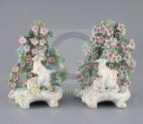 Two similar Derby groups of sheep in a flower arbor, c.1765, scrollwork bases, one with patch marks,