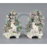 Two similar Derby groups of sheep in a flower arbor, c.1765, scrollwork bases, one with patch marks,