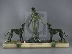 P. Huguenot. An Art Deco bronze and three coloured onyx group of a medieval lady and two hounds,