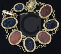 A late Victorian style gold and Intaglio hardstone bracelet, with filigree clasp and safety chain,