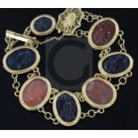 A late Victorian style gold and Intaglio hardstone bracelet, with filigree clasp and safety chain,