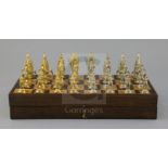 A figural silvered and gilded metal chess set in fitted rosewood and boxwood folding box/chess