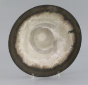 Dame Lucie Rie (1902-1995). A fine stoneware conical bowl, with a bronzed manganese and brown band