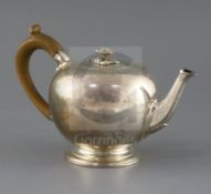A Victorian silver bullet shaped teapot, by Walter Morrisse, with engraved decoration and crest