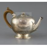 A Victorian silver bullet shaped teapot, by Walter Morrisse, with engraved decoration and crest